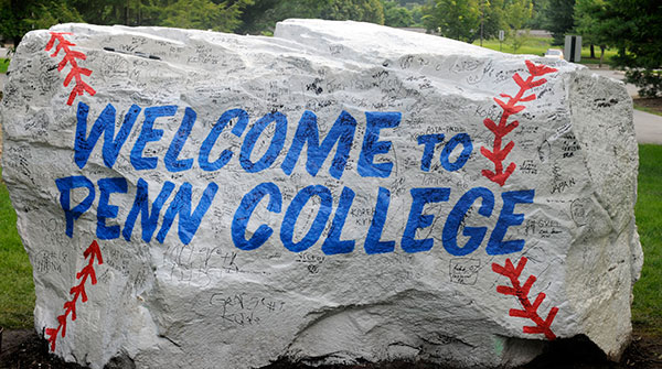 By picnic's end, players' signatures cover a campus landmark – certain to be noticed when students arrive this Welcome Weekend.