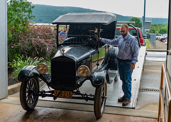 Aubrey Alexander steers the Model T, donated to Penn College by the Blaise Alexander Family Dealerships, into College Avenue Labs on Sept. 13.