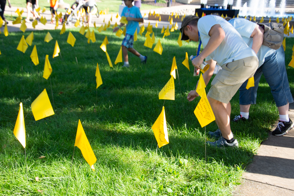 Walkers had the opportunity to place yellow flags along the walkway in remembrance ...