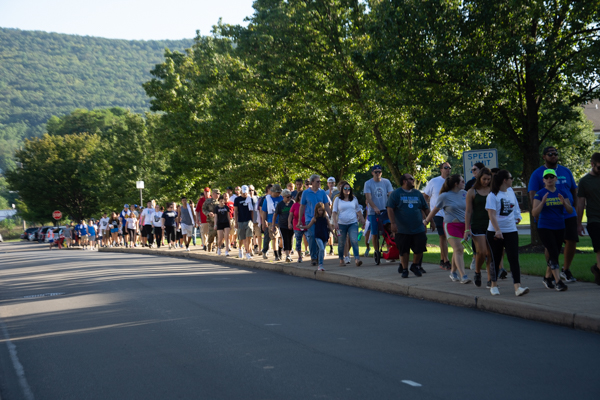 A hundreds-strong throng follows the 2-mile course.