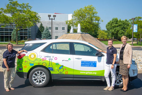 Representing Girl Scouts in the Heart of Pennsylvania are, from left, Valerie Whyman, fund development, and Casey Miller, Lewisburg-based program coordinator, who will use the STEM Mobile to deliver activities directly to girls. At right is Elizabeth A. Biddle, director of corporate relations for Penn College, sponsor of the STEM Mobile.