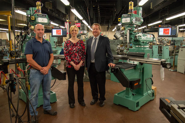 TRAK Machine Tools Inc. recently donated two more computer-numerical-control milling machines for the college’s automated manufacturing lab. With the machines are, from left, Richard K. Hendricks Jr., automated manufacturing and machining faculty member and department head at Penn College; Elizabeth A. Biddle, director of corporate relations for the college; and Rudy Gebhard, senior sales representative, Southwestern Industries Inc.