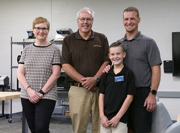 For a class assignment, 9-year-old Trevin Allen described his dream of working in plastics at SEKISUI SPI with his father, Lucas, a graduate of Pennsylvania College of Technology. Trevin’s mature goals prompted an invitation from the college, where he experienced various facets of applied technology. From left are Shannon M. Munro, vice president for workforce development; Tom F. Gregory, associate vice president for instruction; and Trevin and Lucas Allen.
