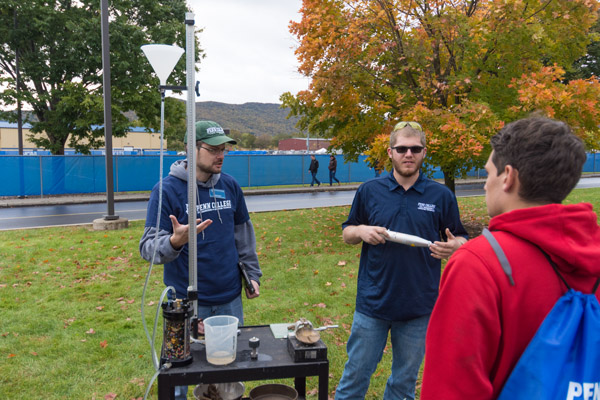 David J. Fedor, instructor of civil engineering technology, is joined by alumnus/student Jason R. Komar, of Waymart, for an outdoor demo. Komar earned a bachelor's in civil engineering technology in May and is completing his dual degree in surveying technology.