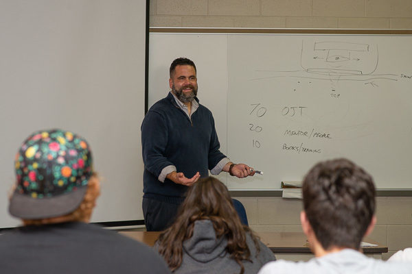 A 2007 recipient of the college's Alumnus Achievement Award, Jeffcoat talks with students during a late-September return to campus.