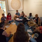 High school visitors settle into a quiet meditation corner in The Gallery at Penn College to participate in Meredith Grimsley’s workshop focused on healing through vulnerability, empathy and stitch. 
