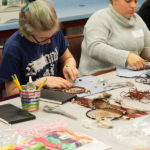 High schoolers enjoy the “Create Your Own Dreamcatcher” workshop. 