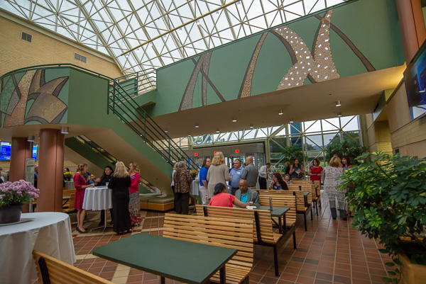 The ATHS atrium offers a beautiful venue for the gathering. 