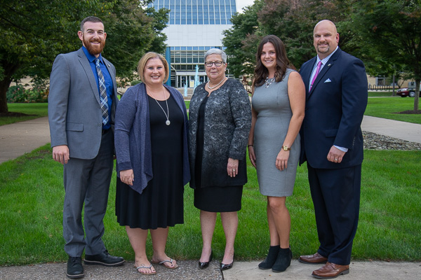 Gathering prior to the Hall of Fame induction ceremony are, from left: Skylar L. Gingrich, Amber L. (Geckle) Dreese, College President Davie Jane Gilmour, Kierstin G. Steer, and Athletics Director John D. Vandevere. 