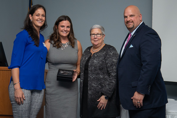 Steer, who was introduced by her former basketball coach Alison Tagliaferri (left), poses with her Hall of Fame ring (in commemorative box), Gilmour and Vandevere. 