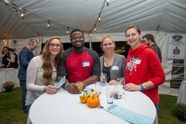 Reveling in reunion are (from left): Erin Sullivan, ’16, applied human services; Semeon De Barros, ’17, aviation maintenance technology and applied management; Victoria L. Kostecki, ’14, baking and pastry arts, and ’16, applied management; Sarah A. Brunksi, ’17, culinary arts and systems. 