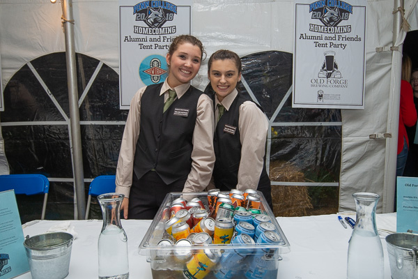 We can’t throw a party without hospitable helpers! Hospitality management students Ireland Q. Hastings (left), from Shippensburg, and Mallory Hoffman, of Pottsville, offer assistance and smiles. 
