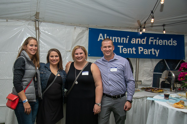 Following the athletics banquet, attendees strolled over to the tent party, where Dreese hung out with her husband, Daniel S. (at right), ’02, computer information systems; and former volleyball teammates Elizabeth (Mast) Petersheim (left), ’07, accounting; and Maria “Mia” K. McNett, ’07, occupational therapy assistant, and ‘09, applied health studies.