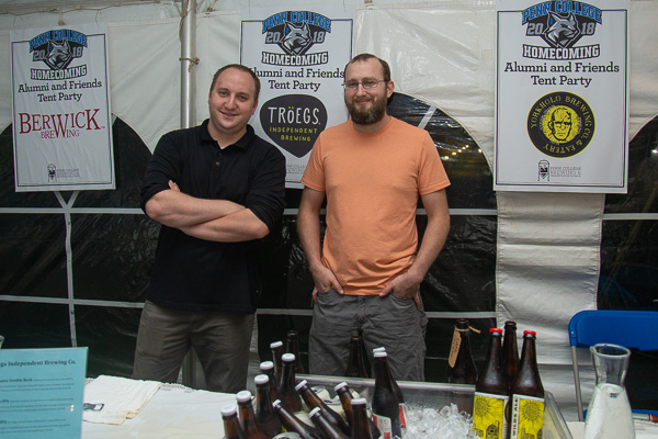 Brewing and fermentation science students in their element: Luke H. Brown (left), of Beaver, and Ryan J. Hampton, of Williamsport, ready to serve up some drinking-down deliciousness. 