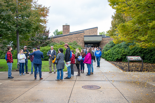A large crowd emerges from the Thompson Professional Development Center following an overview session presented by the School of Construction & Design Technologies. (Assistant Dean Naim N. Jabbour is in the blue suit, his back to the camera.)