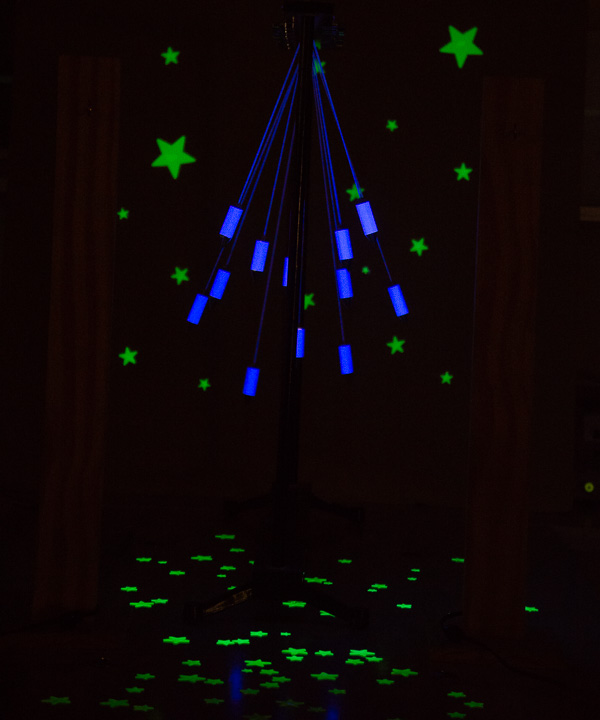 A glow-in-the-dark pendulum delights guests in the “Haunted Physics Lab.”