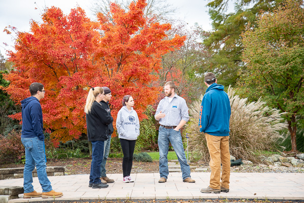 The gorgeousness of autumn has arrived at the Schneebeli Earth Science Center! Justin Shelinksi (center), laboratory assistant for horticulture, leads an outdoor excursion. 