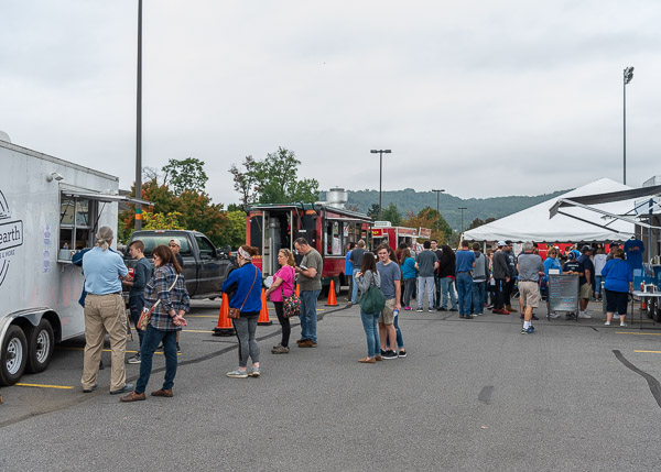A tempting variety of food trucks, representing wares of local vendors, serve patrons west of the Athletic Field.