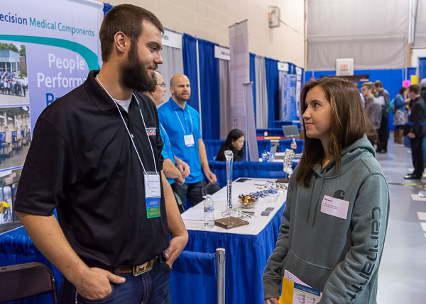 Marena Geiser, of Wellsboro, a welding and fabrication engineering technology student, explores options with Best Line Equipment's Seth Storll.