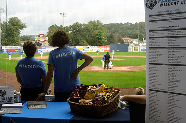 Loni N. Kline (left), vice president for institutional advancement, and Cassel watch the action from the concession area. The Wildcat Club treated fans to free hot dogs, burgers and other refreshments (prepped by Dining Services staff), and offered information on how alumni and others can financially support student-athletes.