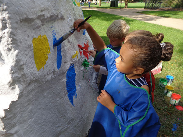 Children paint a campus landmark ...
