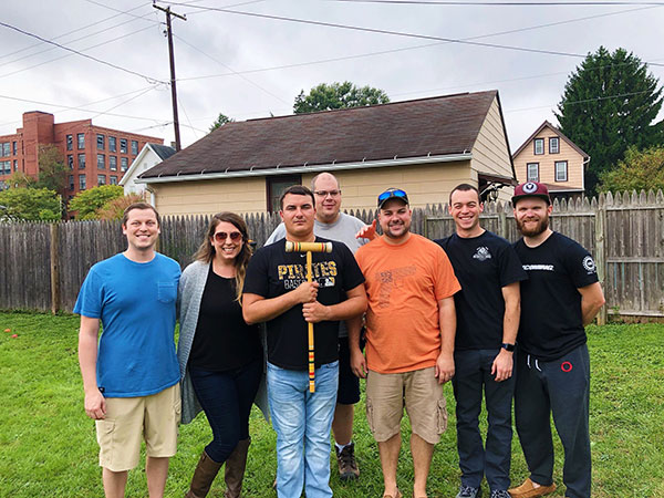 Sigma Nu alumni gathered for a croquet game. 