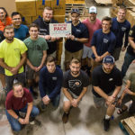 Construction management students contributed a record-setting effort this semester, packing 970 boxes for the agency’s Military Share program.