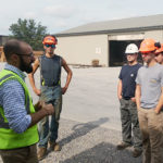 Bingaman's Nicholas Bisaccia talks with Penn College forestry students outside the Kreamer facility.