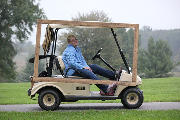 Rhonda S. Walker, alumni relations specialist, puts her cart before the course.