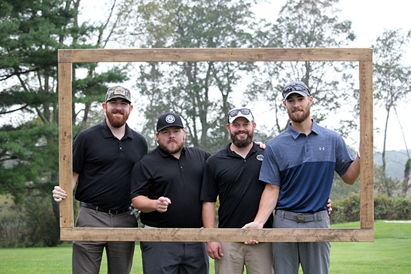 From left: Hall of Famer Gingrich, '13, residential construction technology; Kevin Fink; Garrett A. Hornung, '12, surveying technology and civil engineering technology; and Harrison D. Myers, '12, architectural technology