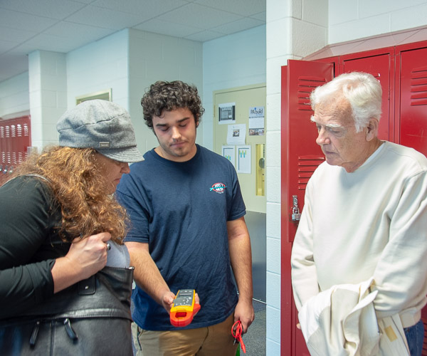 Alex A. Klose, a student in heating, ventilation and air conditioning technology, shows some of his tools to his mother and grandfather. Klose is from Bethlehem. 