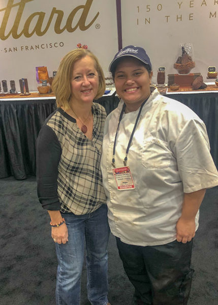 Penn College student Natascha G. Santaella (right), of Guaynabo, Puerto Rico, serves as a teaching assistant to Chef Susan Notter, USA sales professional for Max Felchlin Chocolate.