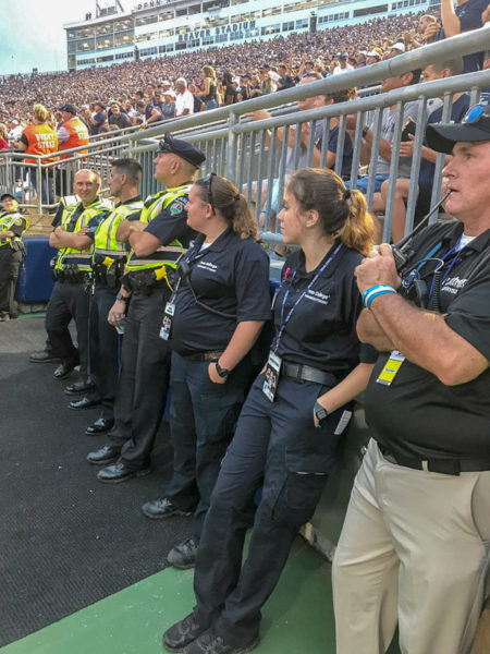 Elizabeth A. Stigerwalt, a paramedic technician student from Danville, and Laura J. Hauck, an emergency medical services student from Milton, join staff in the stadium.