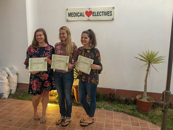From left, Heckman, Kubalak and Bachman accept their certificates upon completion of their medical Spanish immersion experience.