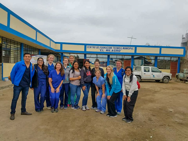 Students gather following a medical campaign in El Milagro, part of the Trujillo urban area. The group saw 53 patients during the event, which mainly served those who did not have regular access to medical care.