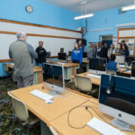 Touring the center, students view a lab equipped with Mac computers donated by an individual inspired by the project’s vision. 