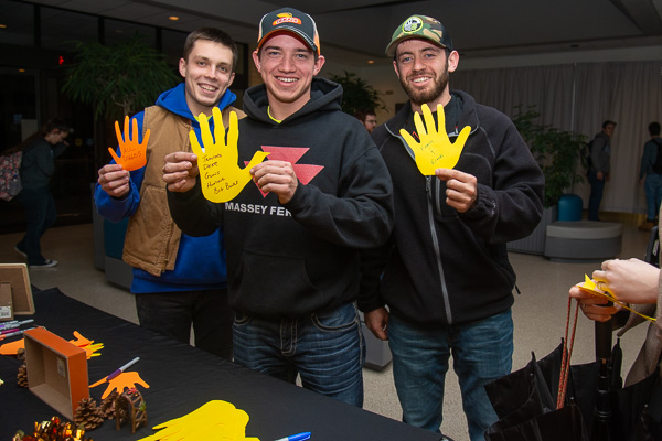 Expressing their gratitude for joys like “family & friends” and “tractors & big bucks” are (from left) construction management students Michael R. Casciola, of State College; Jared T. Hileman, of Hollidaysburg; and Domenick M. Berarducci, of West Newton. At a display created by Community Peer Educators, students could write what they’re thankful for on hand-shaped cutouts (some resembling turkeys) as they waited in the KDR lobby.