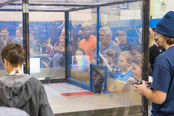 The crowd presses ever closer for a better look.