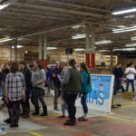Participants gather in the spacious General Services for Wednesday's card-decorating party, among Penn College's familial holiday events.