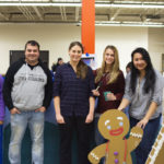 Representatives of the Physician Assistant Club assemble their gingerbread-flavored treat. From left are Dhwani J. Patel, of Williamsport; Timothy A. Bradley, of Williamsport; Christine Szarko, of Manheim; Jordan E. Linder, of Pittsburgh; and Tia G. La, of Williamsport.
