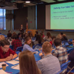 Mark A. Ciavarella, associate professor of business administration/management, teaches high school students about the steps of writing a business plan during an Entrepreneurship Challenge event at the college.