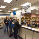 Karen E. Wright, graduation assistant in the Registrar's Office, distributes tickets to December's commencement ceremony.