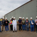 Walker (second from right) and engineering design students benefit from the college's proximity to one of the nation's biggest steel fabricators.