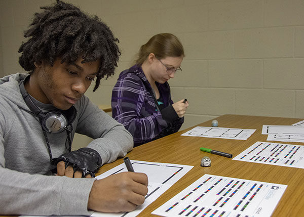 Students from Columbia-Montour Area Vocational-Technical School program paths for small robots called Ozobots using colored markers – a way to code without a computer. The activity was one of several that high school students explored at Pennsylvania College of Technology on Nov. 8 as part of a National STEM Day celebration.