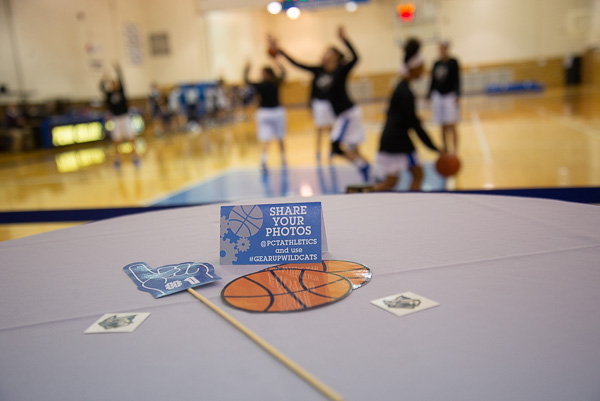 Courtside game props and a reminder to share photos through social media