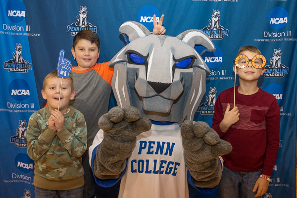 Clownin’ and cattin’ around with the Cassel kids! The Wildcat “paws-es” for a photo op with the sons of Kimberly R. Cassel, director of alumni relations. 