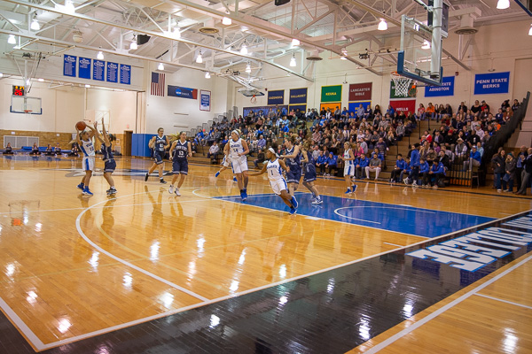 Game action begins in front of a full house.