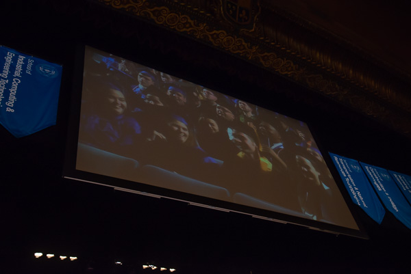 A grad favorite: laughing at classmates' on-screen antics as the camera pans the crowd