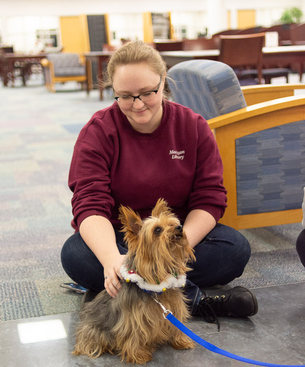 It's a picture of contentment for Crystal J. Rice, a business management major and part-time graphic design student worker in the library, and friend.