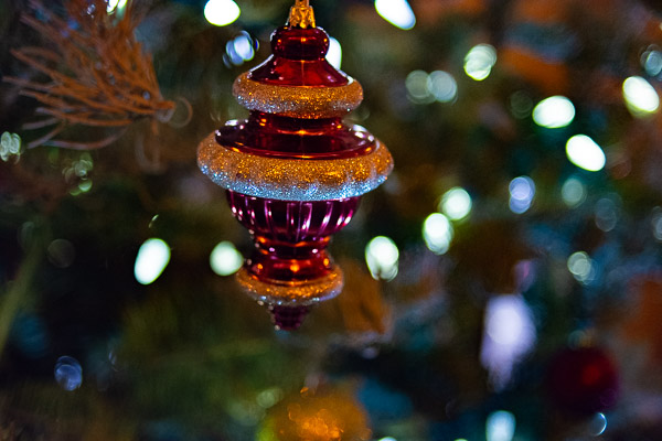 Tree lights dance around a CAC ornament.